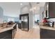Modern kitchen features stainless steel appliances, granite countertops, and tile flooring at 53 Zinnia E Ln, Kissimmee, FL 34759