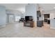 Open-concept living space with tile flooring, elegant lighting, and seamless flow to kitchen at 53 Zinnia E Ln, Kissimmee, FL 34759