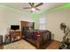 Cozy bedroom with ceiling fan, custom lighting, and comfortable furnishings, ideal for a relaxing retreat at 5759 Marsh Landing Dr, Winter Haven, FL 33881