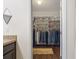 Walk-in closet with custom shelving and organized hanging space, providing ample storage at 5759 Marsh Landing Dr, Winter Haven, FL 33881