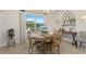 Charming dining area with a round wooden table, decorative accents, and natural light at 5759 Marsh Landing Dr, Winter Haven, FL 33881