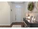 Inviting foyer with a decorative wreath, table lamp, framed pictures, and stylish decor at 5759 Marsh Landing Dr, Winter Haven, FL 33881