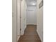 Clean hallway with fresh paint and white trim that create a bright and airy atmosphere at 5759 Marsh Landing Dr, Winter Haven, FL 33881