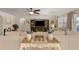 Inviting living room with a plush sectional sofa, stylish decor, and bright windows for ample light at 5759 Marsh Landing Dr, Winter Haven, FL 33881