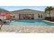 Backyard pool view with an outdoor seating area and a pristine brick-paved deck at 5759 Marsh Landing Dr, Winter Haven, FL 33881