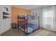 A bedroom featuring a bunkbed and blue and orange sport themed decor at 577 Eagle Pointe S, Kissimmee, FL 34746