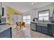 Bright kitchen featuring updated appliances, natural light, and a cozy dining area at 577 Eagle Pointe S, Kissimmee, FL 34746