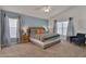 Relaxing main bedroom with high ceilings, natural light, and soothing color palette at 577 Eagle Pointe S, Kissimmee, FL 34746