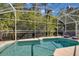 Tranquil screened-in pool with comfortable lounge chairs, offering a private outdoor oasis at 577 Eagle Pointe S, Kissimmee, FL 34746