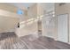 Spacious living room featuring wood-look floors, a neutral color scheme and a staircase at 638 Kangaroo Dr, Poinciana, FL 34759