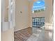 Bright living area with tall ceilings, neutral paint, wood-look floors and sliding glass doors to lanai at 638 Kangaroo Dr, Poinciana, FL 34759