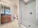 Bathroom with tiled floors, a shower and vanity at 661 Sandy Ridge Dr, Davenport, FL 33896