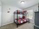 Bedroom with a bunk bed, carpet, and sport themed decorations at 661 Sandy Ridge Dr, Davenport, FL 33896