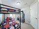 Bedroom with a bunk bed, carpet, and dresser at 661 Sandy Ridge Dr, Davenport, FL 33896