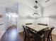 Cozy dining area with modern lighting and seating for six at 661 Sandy Ridge Dr, Davenport, FL 33896