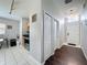 Inviting foyer with hardwood floors and a view of the kitchen at 661 Sandy Ridge Dr, Davenport, FL 33896