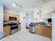 Spacious kitchen showcasing stainless steel appliances and tile flooring at 661 Sandy Ridge Dr, Davenport, FL 33896