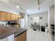 Functional kitchen with essential appliances and adjacent breakfast area at 661 Sandy Ridge Dr, Davenport, FL 33896