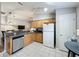 Functional kitchen with essential appliances and a view of the dining area at 661 Sandy Ridge Dr, Davenport, FL 33896