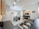 Bright kitchen featuring stainless steel appliances, track lighting, and cozy dining area at 661 Sandy Ridge Dr, Davenport, FL 33896