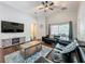 Comfortable living area featuring wood floors, vaulted ceilings, and natural light at 661 Sandy Ridge Dr, Davenport, FL 33896