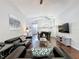 Spacious living room with vaulted ceilings and a view of the dining area at 661 Sandy Ridge Dr, Davenport, FL 33896