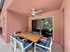 Covered patio with dining set, perfect for outdoor entertaining at 661 Sandy Ridge Dr, Davenport, FL 33896