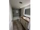 Modern bathroom with tiled shower and flooring, updated vanity, and neutral color palette at 664 Lake Villas Dr, Altamonte Springs, FL 32701