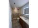 Bathroom featuring a walk-in shower with glass door and a vanity with ample counter space at 664 Lake Villas Dr, Altamonte Springs, FL 32701