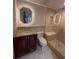 Bathroom with tiled walk-in shower and vanity featuring granite countertop and lighted mirror at 664 Lake Villas Dr, Altamonte Springs, FL 32701