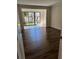 Bedroom featuring hardwood floors and access to a private outdoor patio at 664 Lake Villas Dr, Altamonte Springs, FL 32701