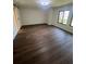 Bedroom with hardwood floors, natural light and sliding barn door at 664 Lake Villas Dr, Altamonte Springs, FL 32701