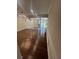Spacious living room with wood floors and a view of the backyard and water beyond at 664 Lake Villas Dr, Altamonte Springs, FL 32701