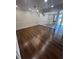 Open living space with hardwood floors, bright lighting, and serene views at 664 Lake Villas Dr, Altamonte Springs, FL 32701