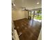 Cozy living space with hardwood floors, ceiling fan, and sliding glass doors to the backyard at 664 Lake Villas Dr, Altamonte Springs, FL 32701