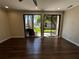 Bright living room with hardwood floors, recessed lighting, and sliding glass doors to the outdoors at 664 Lake Villas Dr, Altamonte Springs, FL 32701