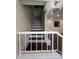 Stairway featuring carpeted steps and white railing leading to the upper level at 664 Lake Villas Dr, Altamonte Springs, FL 32701