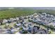Aerial view of a residential neighborhood with many houses and tree-lined streets at 6953 Broglie St, Orlando, FL 32827