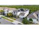 A beautiful overhead view of a two-story home equipped with solar panels on the roof and a paved driveway at 6953 Broglie St, Orlando, FL 32827