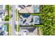 Aerial view shows a house with solar panels, pool and trampoline in a fenced yard at 6953 Broglie St, Orlando, FL 32827