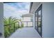 A cozy balcony with black framed glass and cable railings off the side of the house at 6953 Broglie St, Orlando, FL 32827