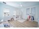 Bright bedroom with a custom bunk bed, white furniture, and light wood floors at 6953 Broglie St, Orlando, FL 32827