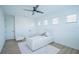Bright bedroom with a plush bed, wood floors, and ample natural light at 6953 Broglie St, Orlando, FL 32827