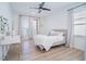 Bright bedroom featuring a desk, comfortable bed, and plenty of natural light at 6953 Broglie St, Orlando, FL 32827
