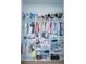 Organized walk-in closet with built-in shelves and hanging rods for clothing storage at 6953 Broglie St, Orlando, FL 32827