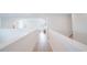Upstairs hallway with hardwood floors and white trim at 6953 Broglie St, Orlando, FL 32827