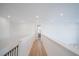 Hallway with hardwood floors and recessed lighting at 6953 Broglie St, Orlando, FL 32827