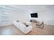 Living room with a sectional sofa, hardwood floors, and recessed lighting at 6953 Broglie St, Orlando, FL 32827