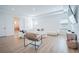 Bright living room featuring hardwood floors, recessed lighting, and modern furniture at 6953 Broglie St, Orlando, FL 32827