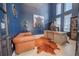 Modern office space with a large desk, comfortable seating, and bold blue walls for a creative atmosphere at 6953 Broglie St, Orlando, FL 32827